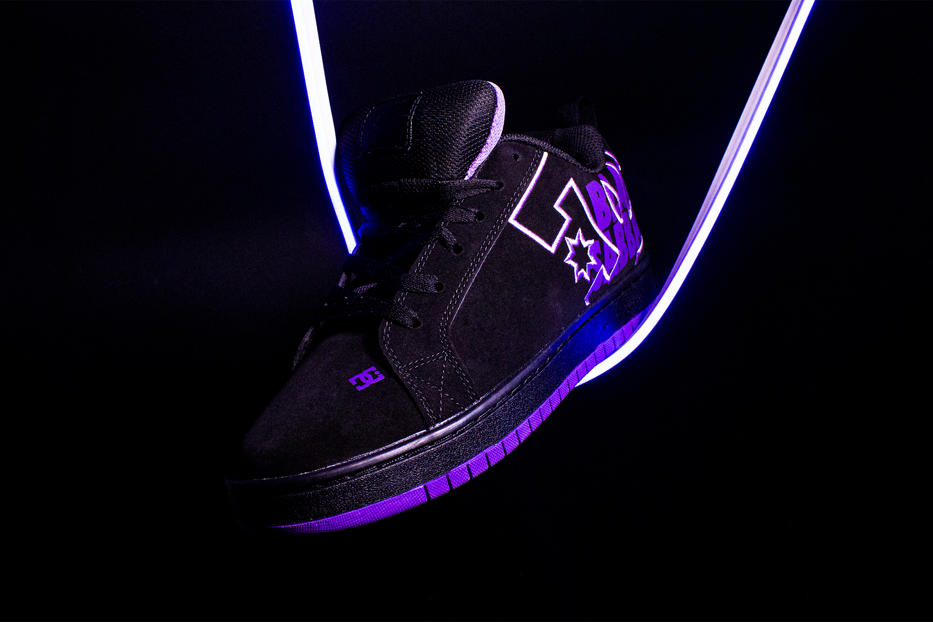 Purple and black dc 2024 shoes